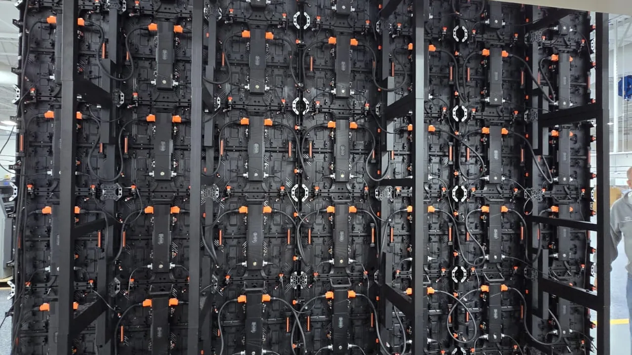 Back of a 3.5m x 3m rental-series LED screen showing the cabinet structure and fast-lock connectors